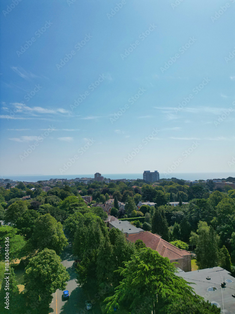 Fototapeta premium Bournemouth Beach and Ocean City of England. Aerial Footage Was Captured During Hot Sunny Day of 12th, August 2025 With Drone Camera. Bournemouth City is Most Attractive Tourist Attraction of England.