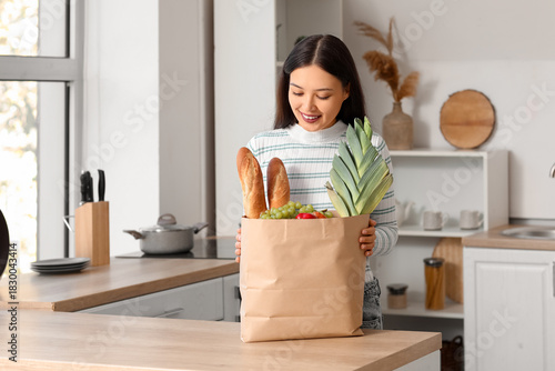Young Asian woman with shop...