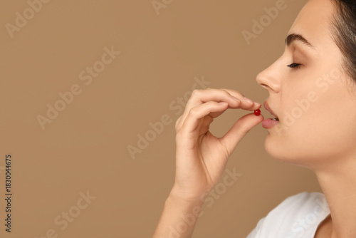 Pretty young woman taking v...