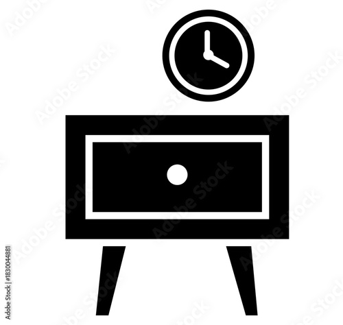 A close up of a black and white cat with striking green eyes looking directly at the camera with a curious and intense gaze