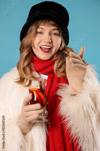 Smiling young woman in wint...