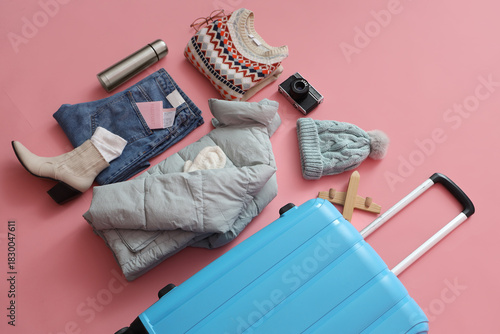 Suitcase with warm clothes,...