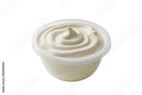 A clear plastic tub filled with creamy white sauce, perhaps mayonnaise, sour cream, or yogurt, featuring a decorative swirl on top. background removed
