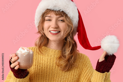 Pretty young woman in Santa...
