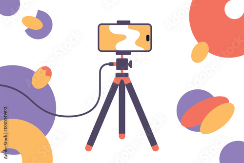 A smartphone is mounted on a tripod, ready to record content.