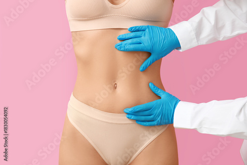 Young woman with flat belly...
