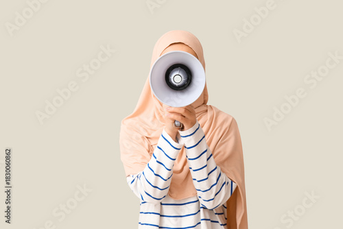 Young Asian Muslim woman wi...