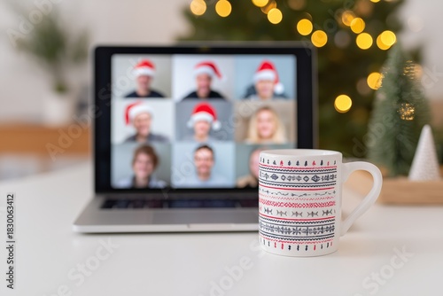 Diverse remote team on a video call displayed on a laptop screen, featuring festive holiday hats, with a cozy mug in the foreground and a Christmas tree in the background