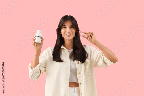 Young woman with vitamin B ...