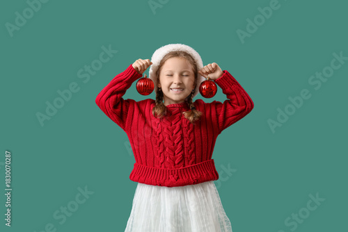 Happy little girl in santa ...