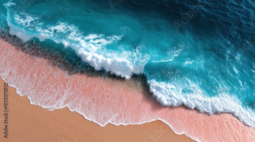 Fototapeta Naklejka Na Ścianę i Meble -  Overhead shot of rhythmic waves meeting a vibrant pink sand beach, glowing under a vibrant sunset. 