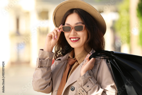 Happy young woman in sungla...