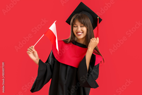 Happy female graduate with ...