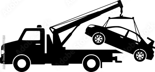 Silhouette of a tow truck lifting a broken down car with its crane

