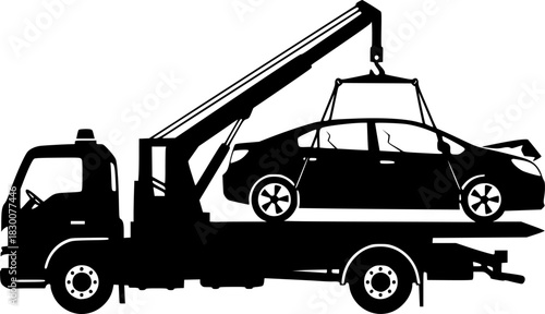 Silhouette of a tow truck lifting a broken down car with its crane
