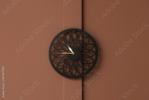 Stylish clock hanging on br...