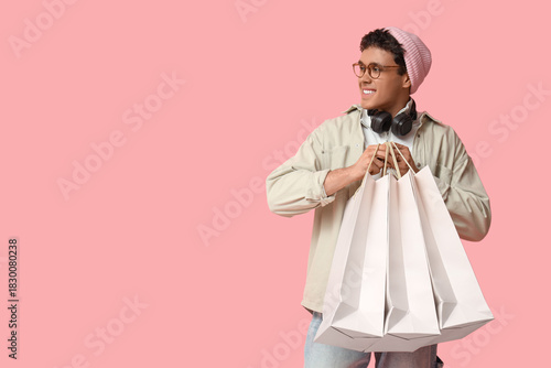 Stylish young man with shop...