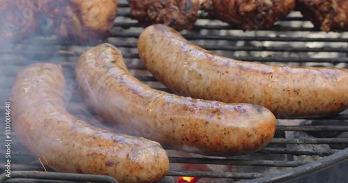 Sausages on a Barbecue Grill with Dramatic Flame Ups