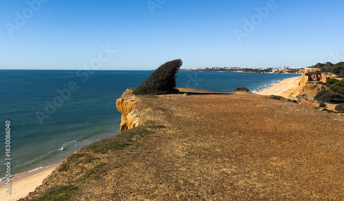 Rocky seashore. View of Praia da Vigia and Praia dos Arrifes beach in Albufeira, Algarve, Portugal, Europe.