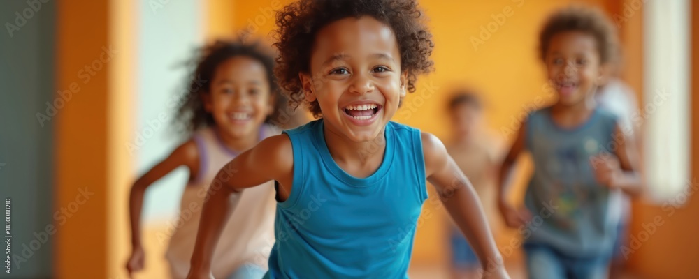 Obraz premium Young African American boy runs forward, laughing happily. Children chase behind, smiling. Kids engage in active games indoors. Fun in bright room, full of childhood energy, movement, joy.