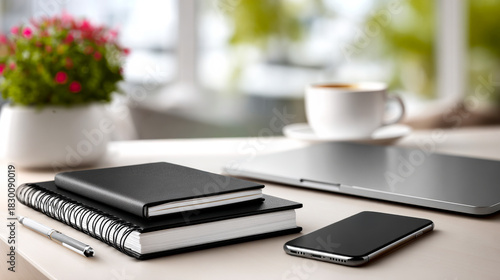 Wallpaper Mural Workspace, notebooks and coffee. A cozy workspace features notebooks, a smartphone, and coffee on a table near a window with plants. Torontodigital.ca