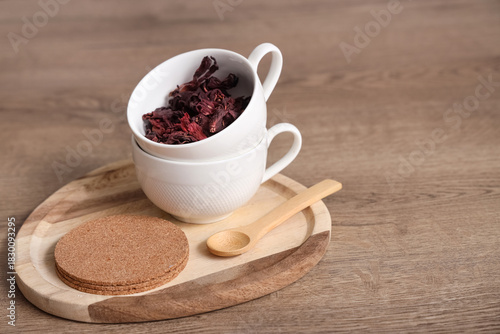 Cups with dry hibiscus tea,...