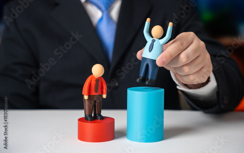 The businessman marks the winner and promotes him. Career advancement, employee recognition and merit based rewards. HR motivation , leadership training and corporate success stories.