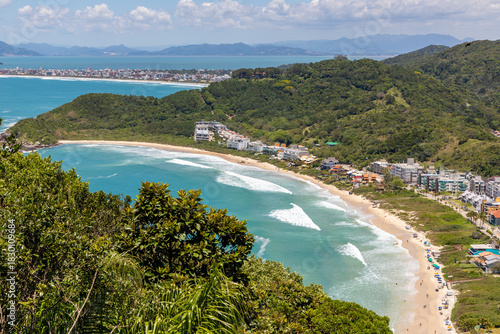 Quatro Ilhas beaches with buildings, mountains, forest and Mariscal beach in background