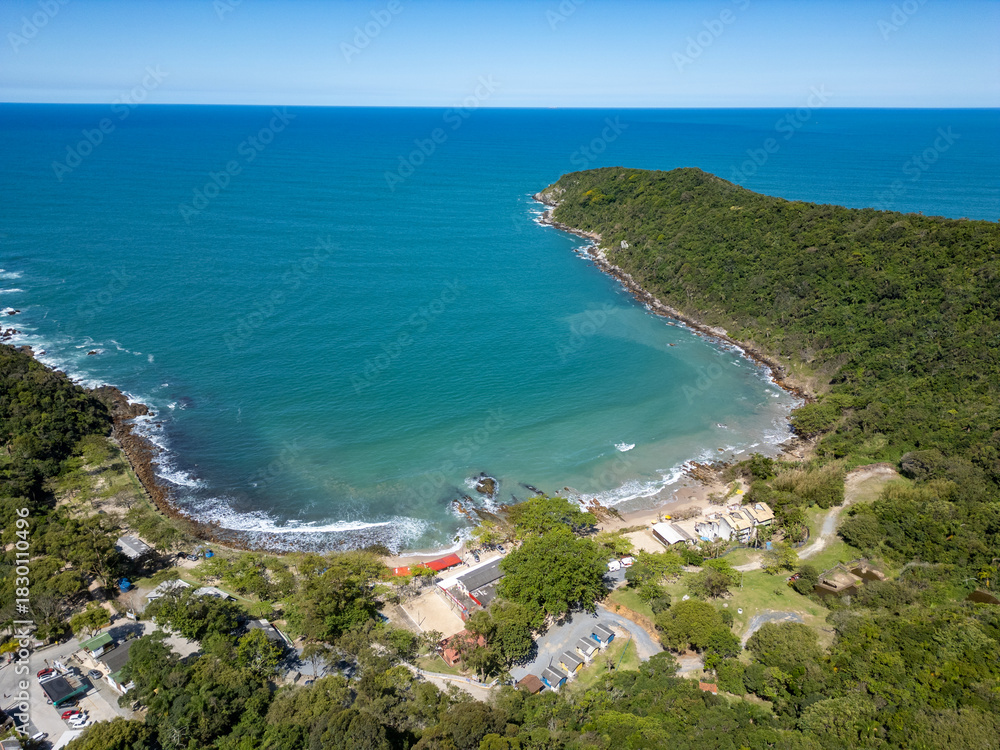 Fototapeta premium Aerial view of Retiro dos Padres beach with sand, rocks and forest