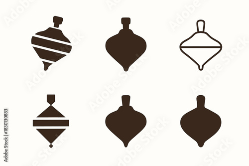 Classic Toy Logos. Classic toys. Icon set. Set Logo of classic toys: spinning top toy. harmonious logo variations of the same emblematic concept, each with