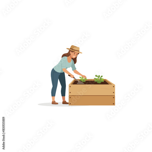 Woman attentively cultivating her raised garden bed, fostering growth and connection with nature