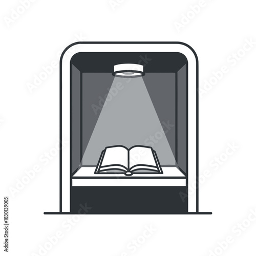 Open book displayed under a spotlight in a display case.