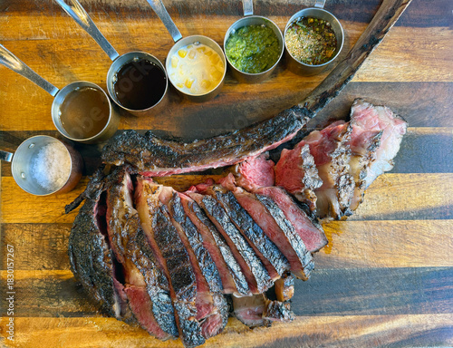Tomahawk steak, the delicious grilled meat  dishes on the barbecue grill showcase a savory dinner meal