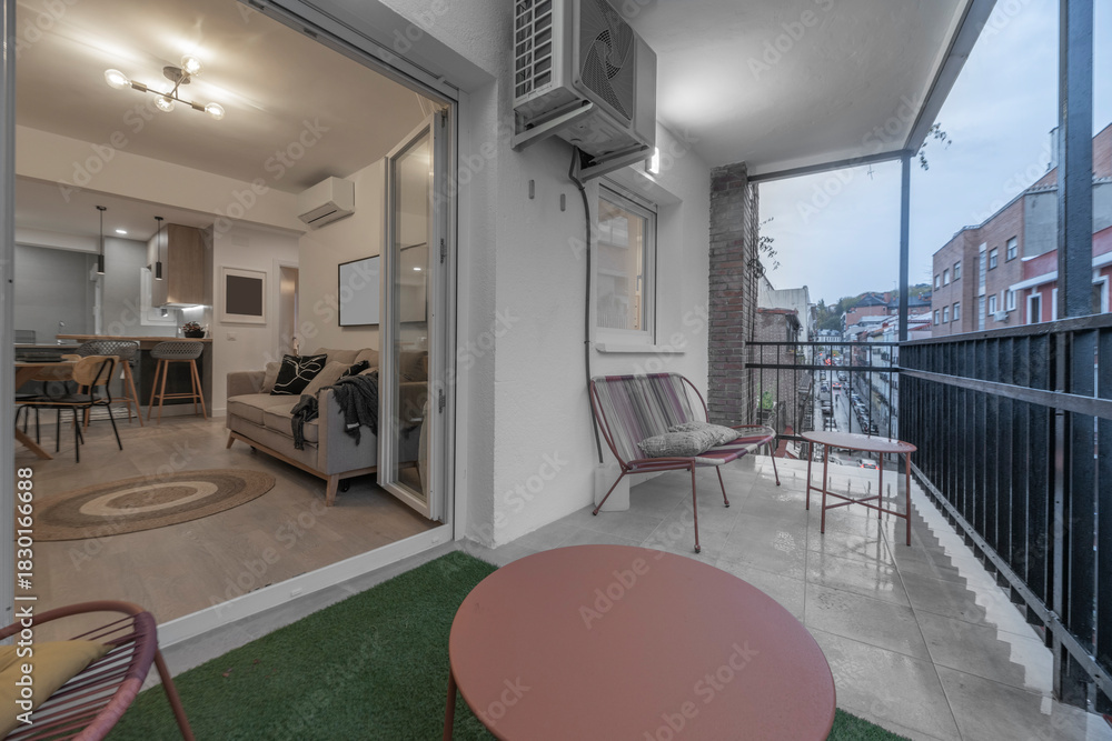 Obraz premium Romantic terrace with a hammock, scented candles, and jasmine vines that perfume the air at dusk