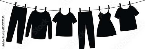 Silhouette of clothes hanging on laundry line with clothespins, black and white drying garments vector illustration for home and fashion design