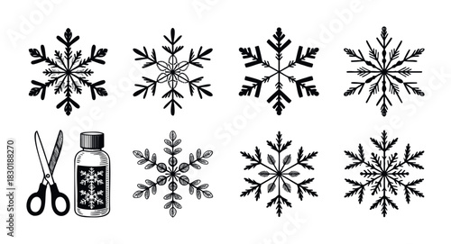 Collection of decorative snowflakes and winter craft elements including scissors and bottle for festive holiday projects and seasonal promotions