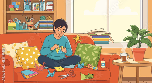 Young adult crafts origami on the couch in their sunny living room