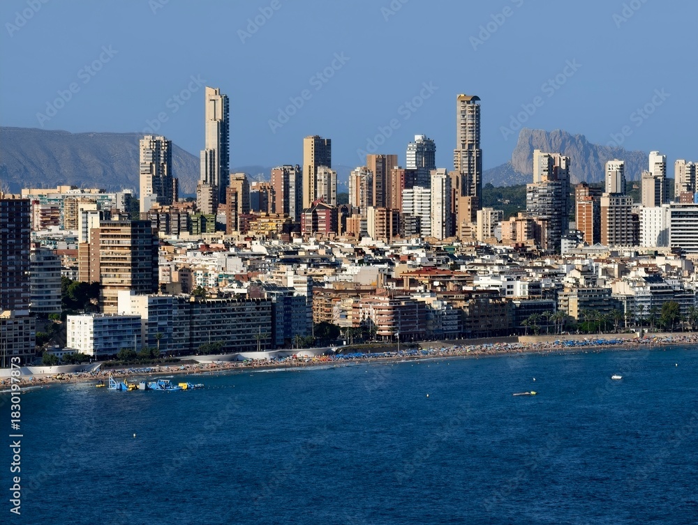 Fototapeta premium skyscrapers along sandy beaches, lively beachfront area featuring highrise buildings and leisure