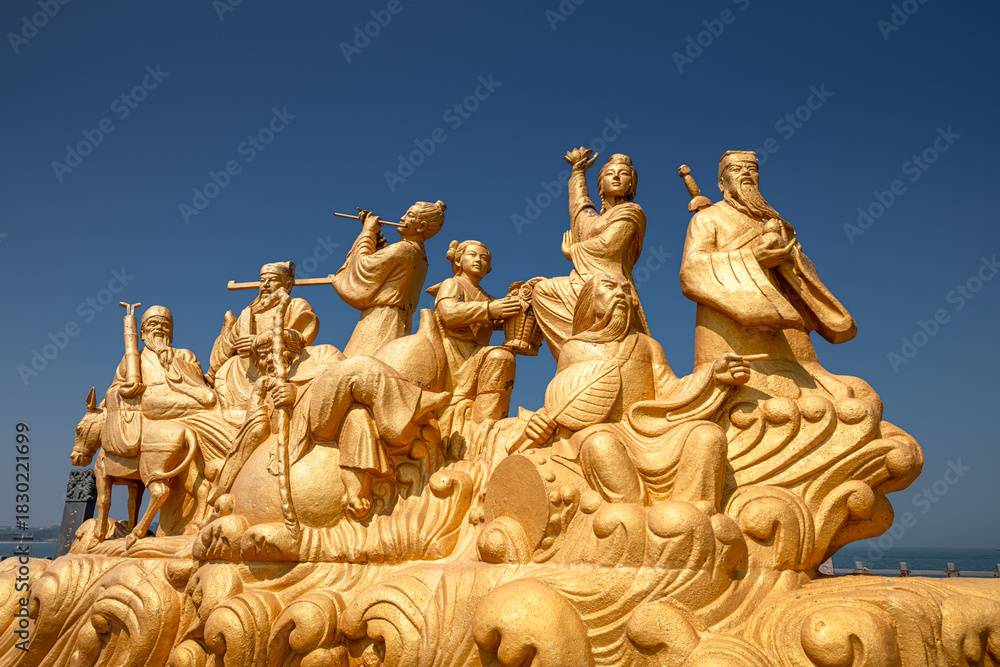 Obraz premium The golden statues of the eight immortals in the pavilion of Penglai, China