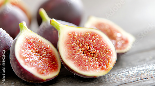 Fresh figs cut in half showcasing vibrant colors and unique textures, perfect for healthy recipes and creative cuisine.