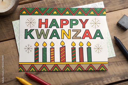 Bright happy kwanzaa card with candles and colorful decorations on wooden table