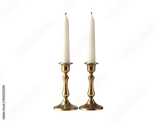Two ivory candles in brass holders