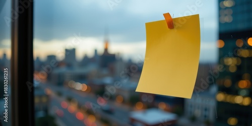 Strategic data canvas concept. A sticky note hangs in front of a blurred cityscape at dusk.
