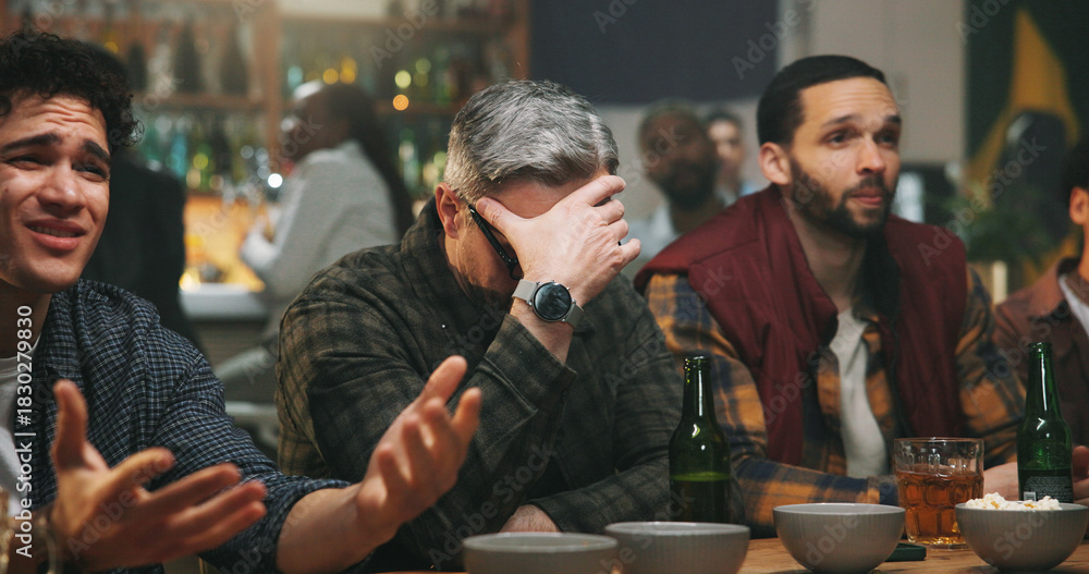 Obraz premium Disappointed, men and watching game in pub, unhappy and thinking of team failure, audience and upset. Frustrated, fans and people with alcohol in bar, sad and live stream of world cup or tournament