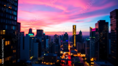 Wallpaper Mural City skyline at dusk featuring blurred lights and a vibrant pink sunset. Torontodigital.ca