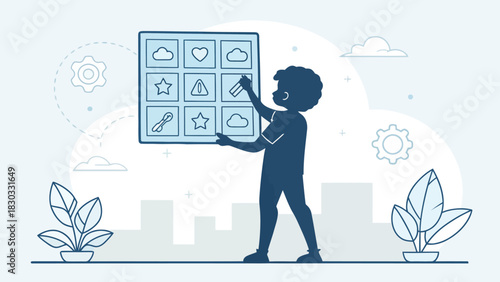 Creative young boy designing innovative user interface with icons for mobile app development process concept