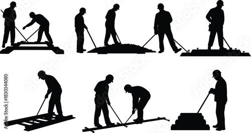 Silhouette railway workers installing and maintaining train tracks using construction tools and teamwork to ensure safe rail transportation infrastructure development