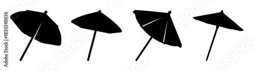 Four black silhouette cocktail umbrellas vector art illustration, perfect for festive drink decorations, evoking tropical holidays, summer parties, refreshing beverages, celebration, and relaxation.