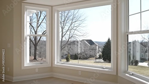 Wallpaper Mural Interior view of a large bay window overlooking a suburban neighborhood. Torontodigital.ca