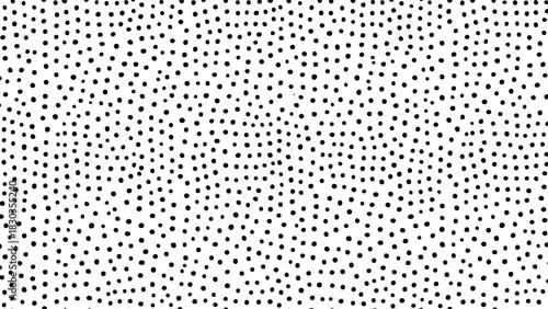 Abstract seamless pattern background of small black dots scattered randomly on a clean white surface, creating a minimalist texture or halftone effect for graphic design